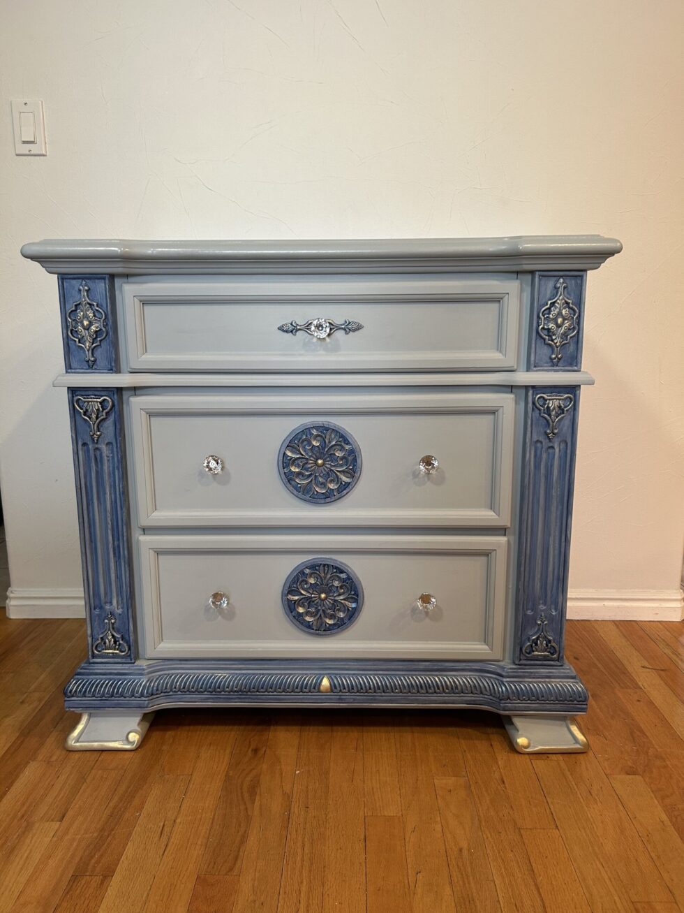 It is very clean and sturdy. You can use for entry table or bed side table or dresser too. The color is light blue and highlighted with navy blue and gold. Dimensions Wide 36” Depth 20” Height 34.5”